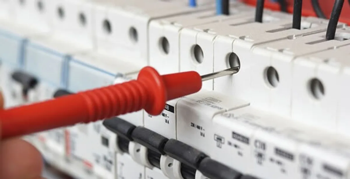 Electrical contractor testing circuit breakers during electrical repair in Wellington, FL