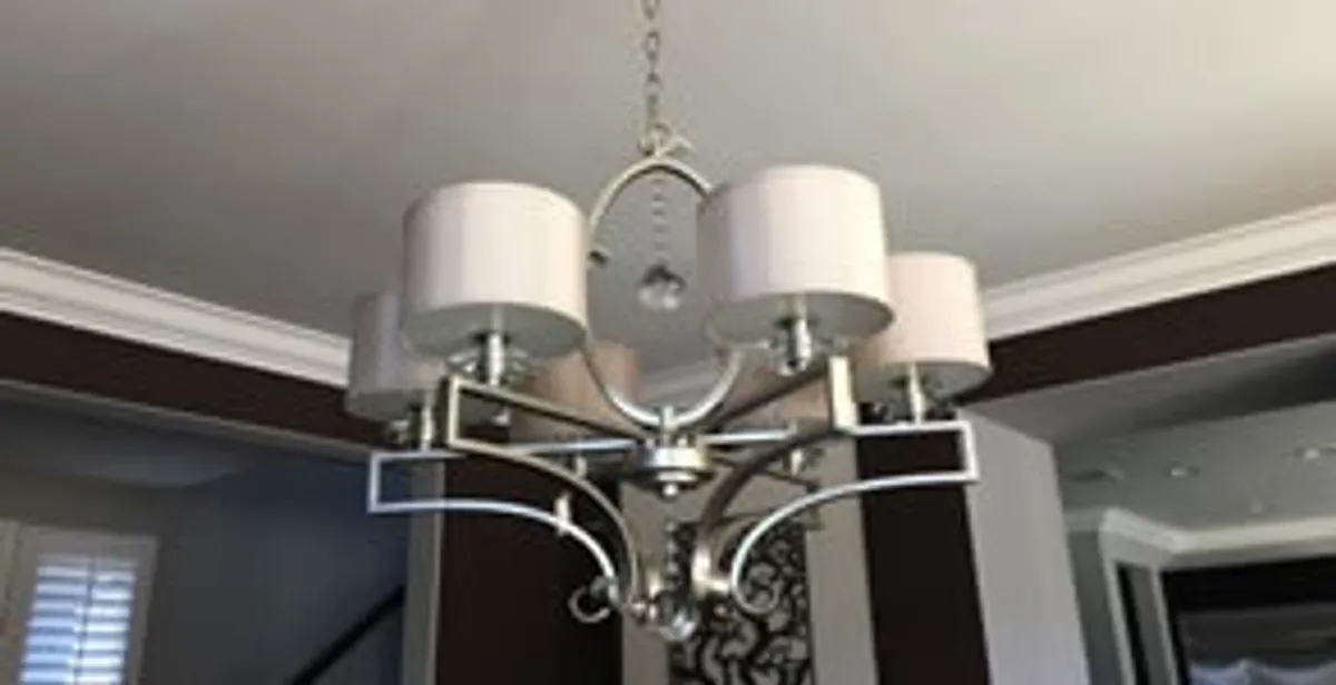 Modern chandelier installation with multiple light fixtures in West Palm Beach, FL