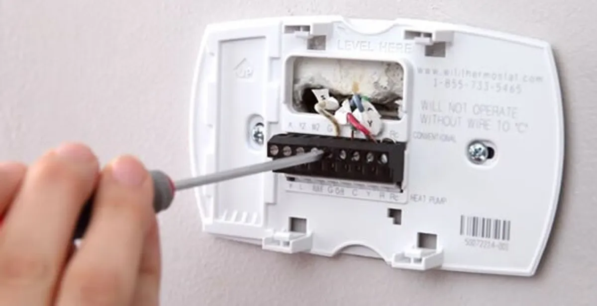 Thermostat installation service with proper wiring and secure wall mounting in West Palm Beach, FL